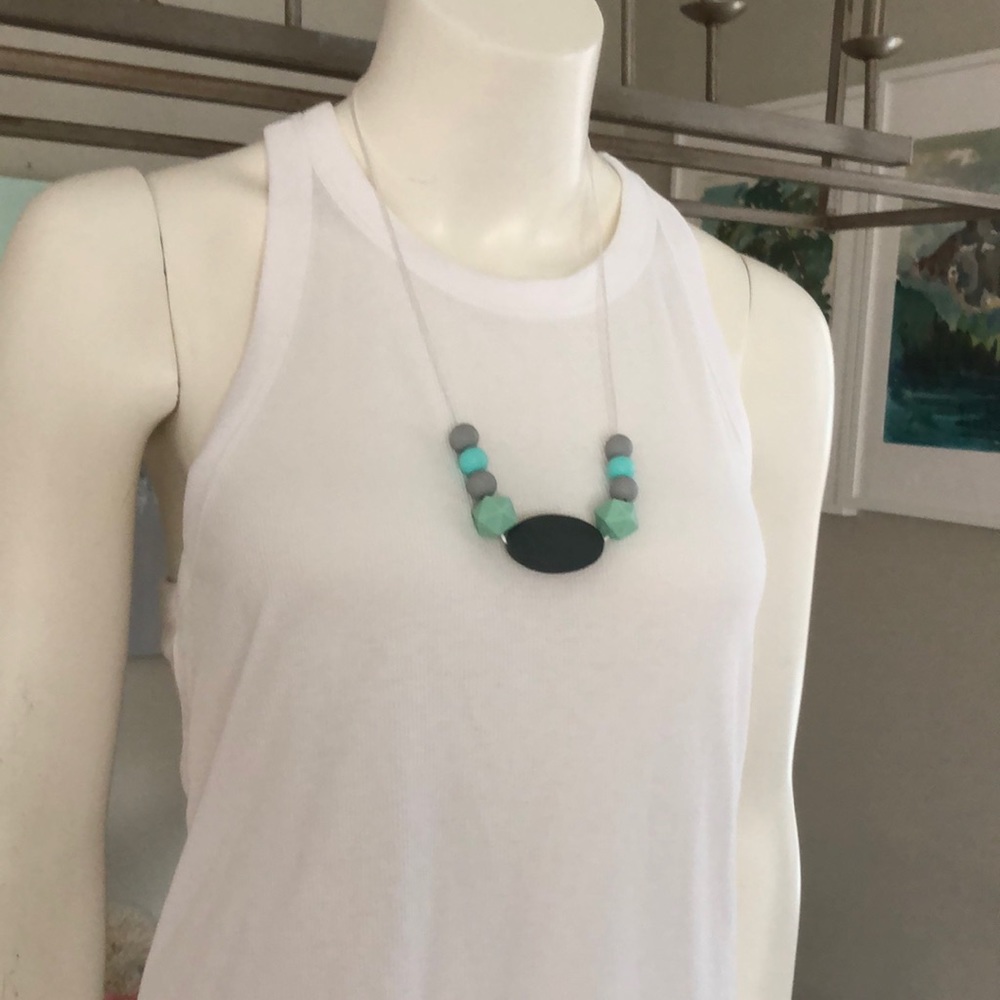 Silicone teething necklace. Made with non-toxic silicone beads.